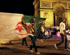algerie-football-mondial-paris-algerian-soccer-fans-celebrate-near-the-arc-de-triomphe-after-algeria-s-2014-world-cup-group-h-soccer-match-against-russia-in-paris-4944063-230x180.jpg
